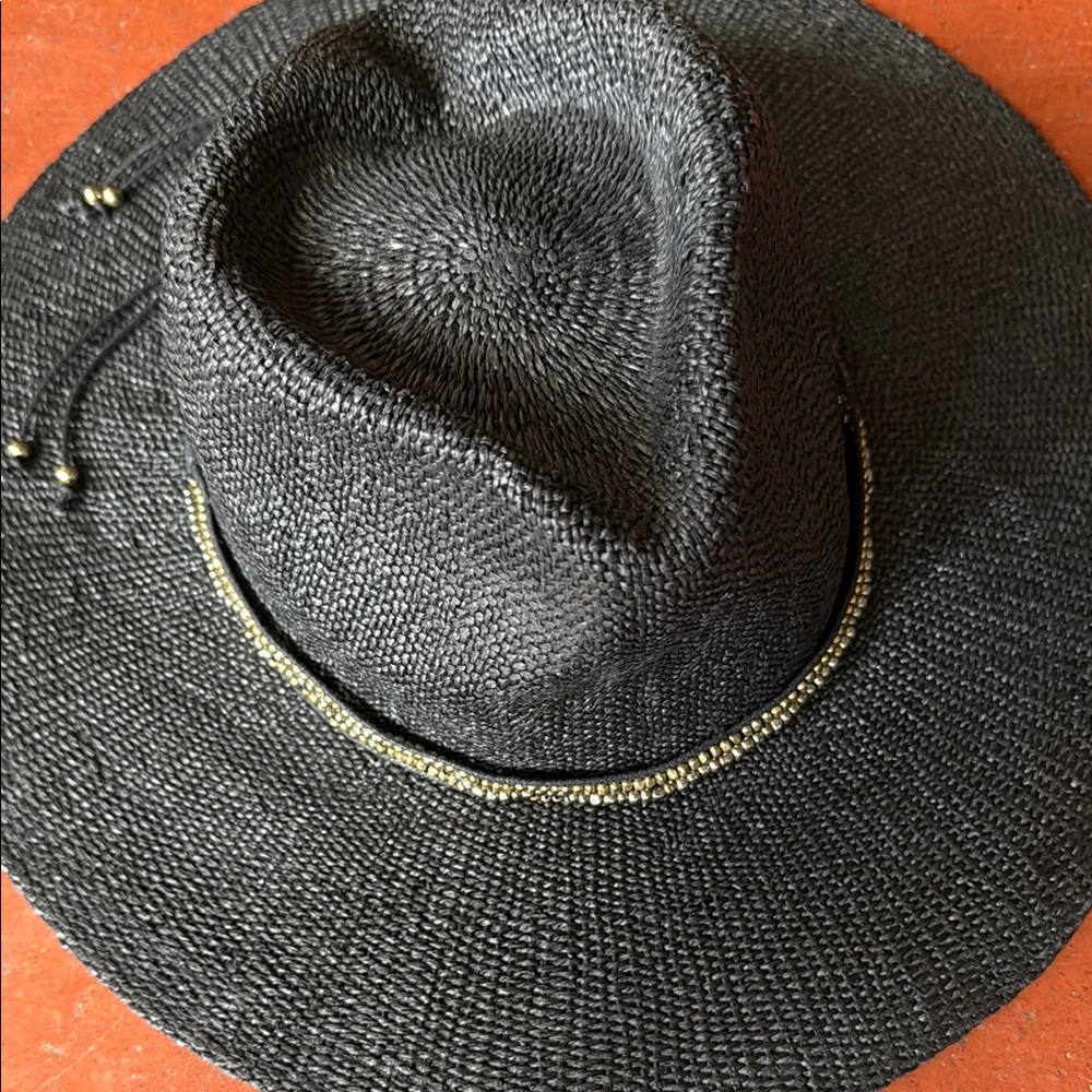 Sophisticated Black Hat with Gold Detailing